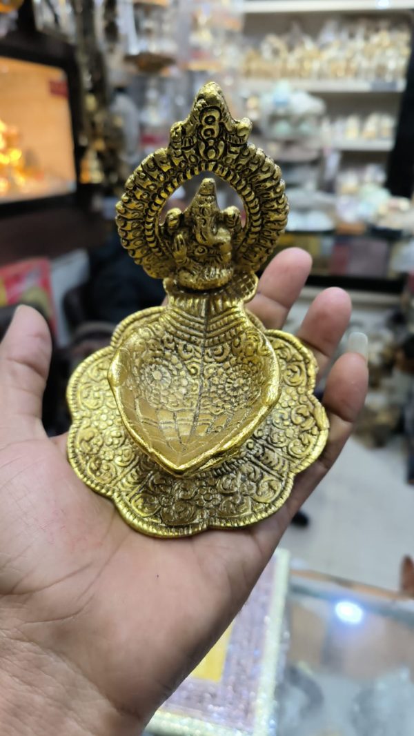 Golden Metal Ganesha Hand Shape Diya 4.5 Inch – Navgraha.in