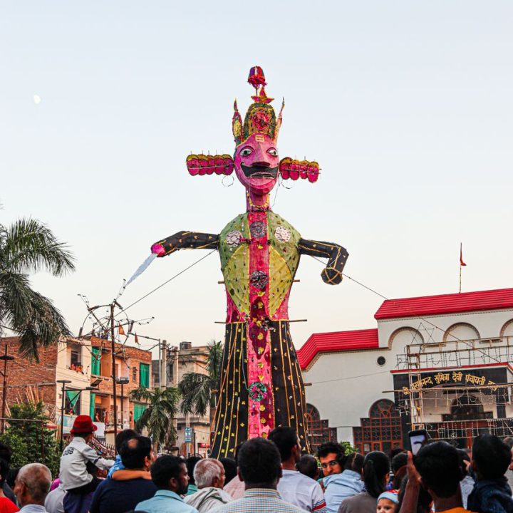 people carrying an effigy during a traditional dussehra festival in india