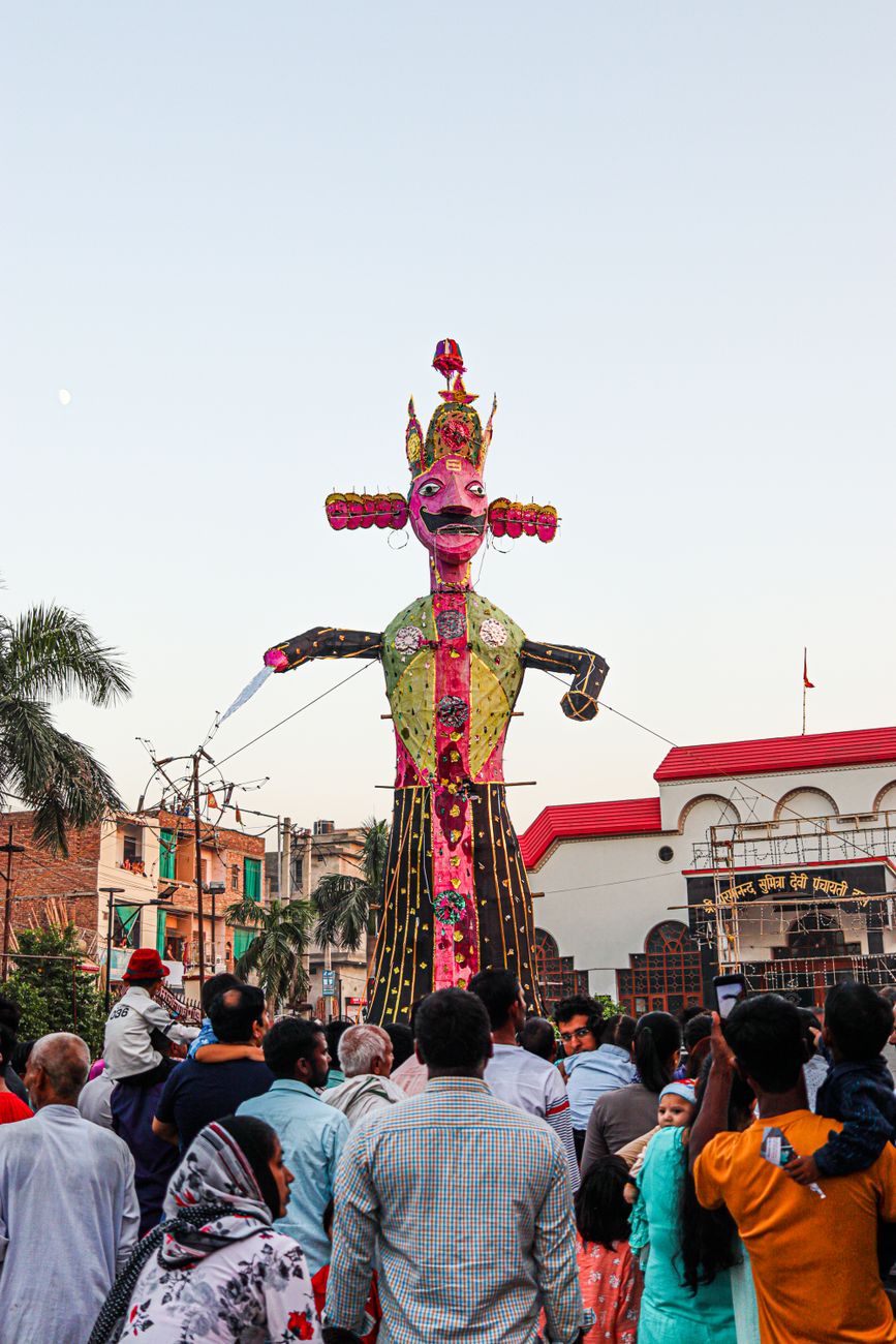 people carrying an effigy during a traditional dussehra festival in india
