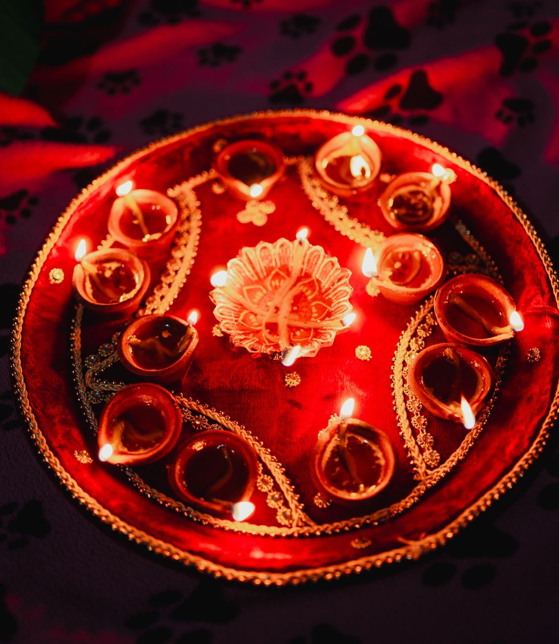 traditional decorative diwali candle with ornaments and flames